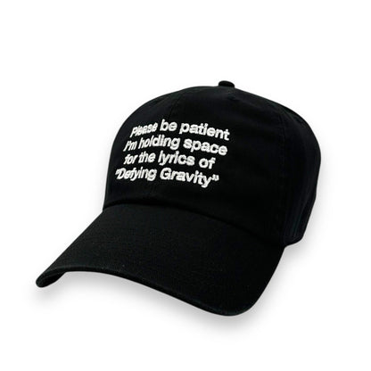 Please Be Patient I'm Holding Space For The Lyrics of Defying Gravity Hat.